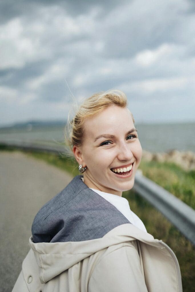 Woman smiling after personalized hormone therapy for menopause support