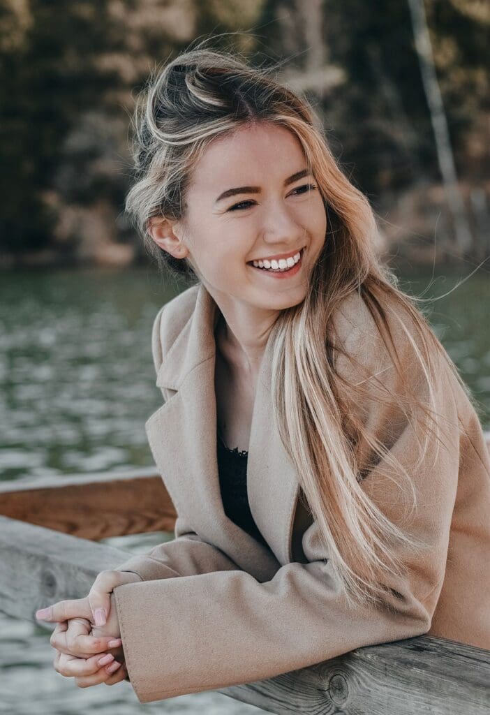 Woman laughing after personalized thyroid management support for energy and wellness